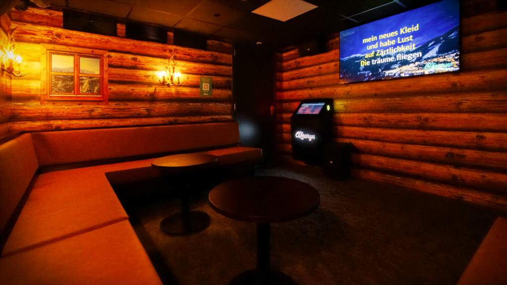 A warm and inviting private karaoke room by SUNVIG, inside restaurant O'Leary's.